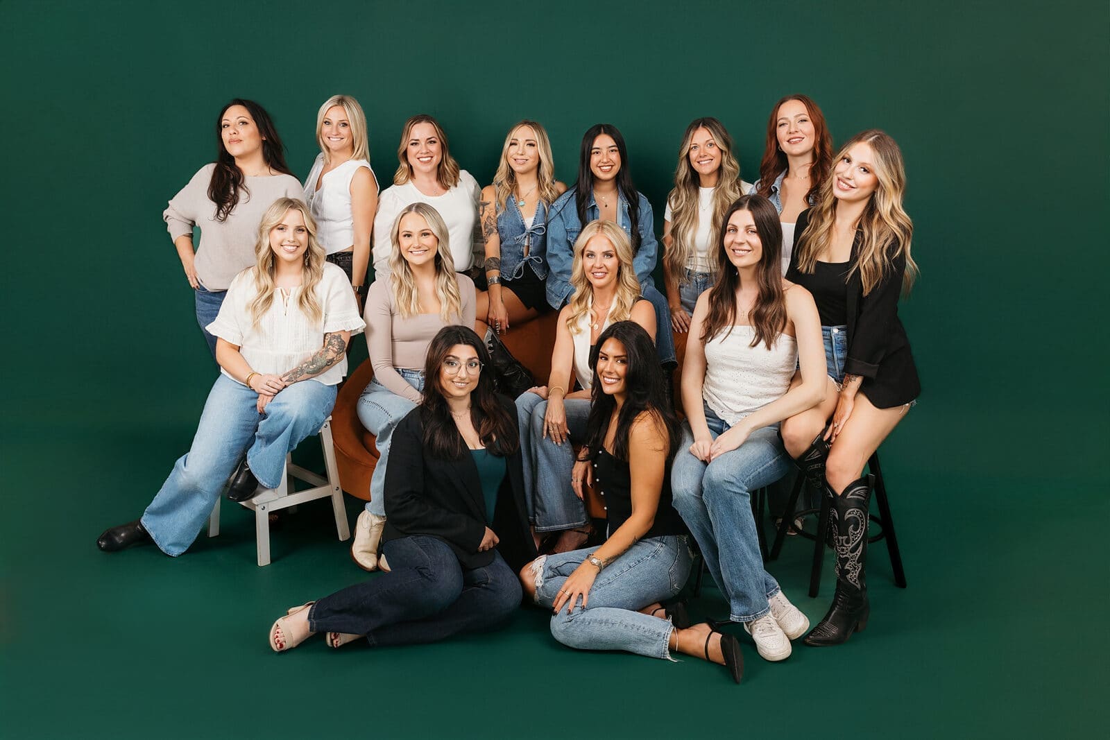 Stylists from bex+Co.® together on a dark green backdrop